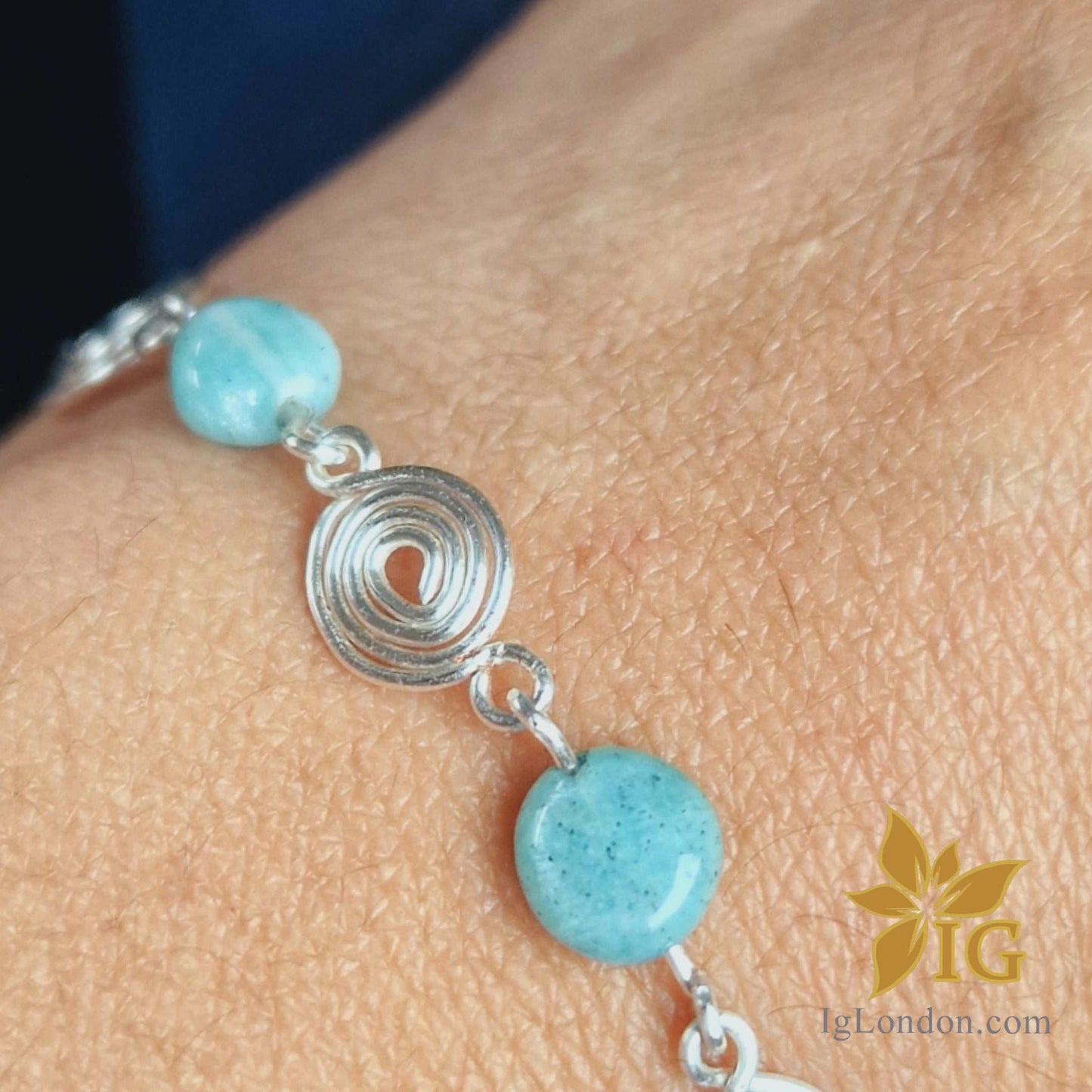 Spiral bracelet with amazonite crystal and silver detail.